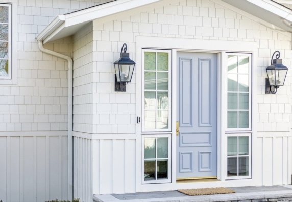 close up view of white james hardie siding on a facade