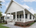 angled view of single story home with white james hardie siding
