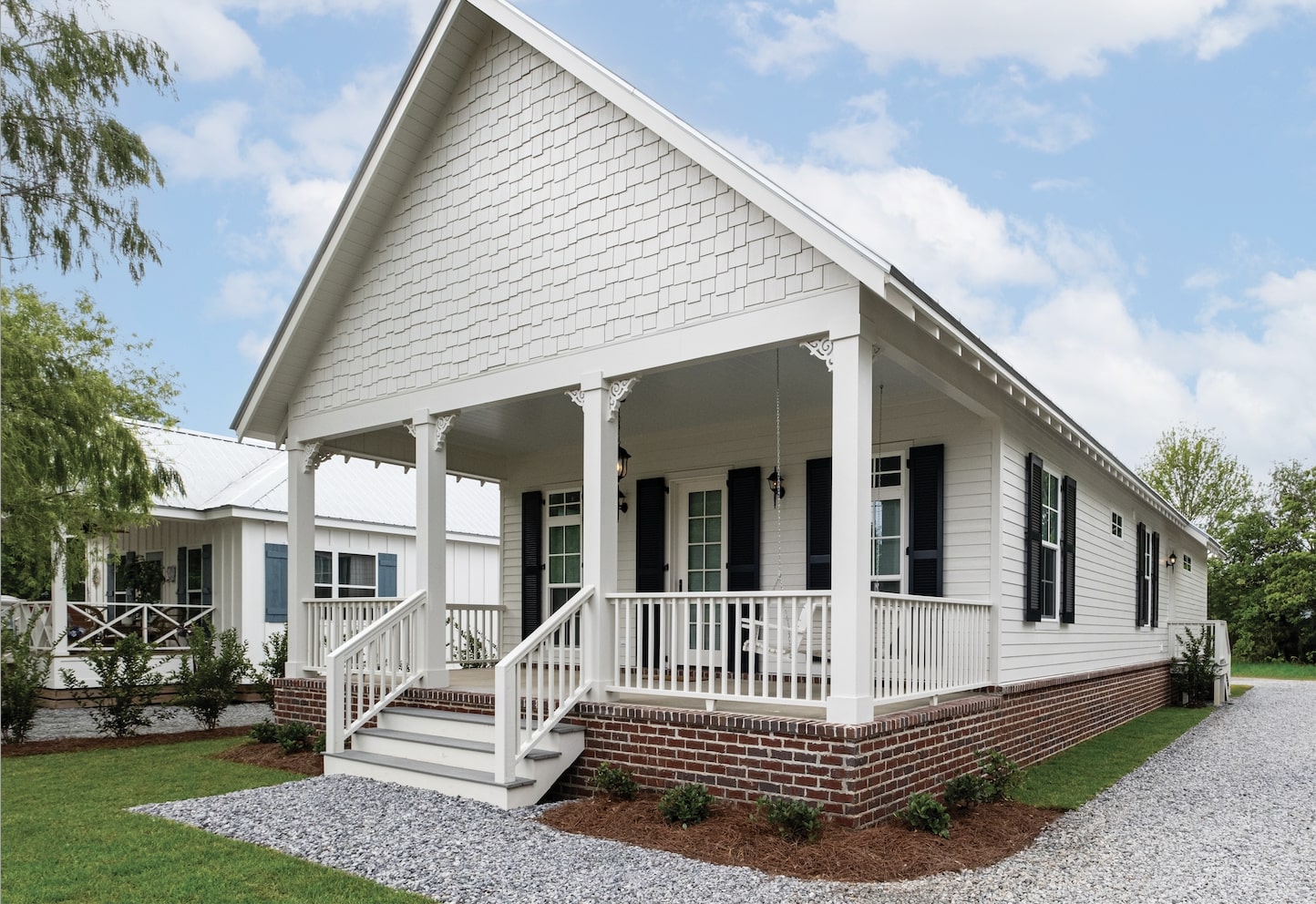 angled view of single story home with white james hardie siding